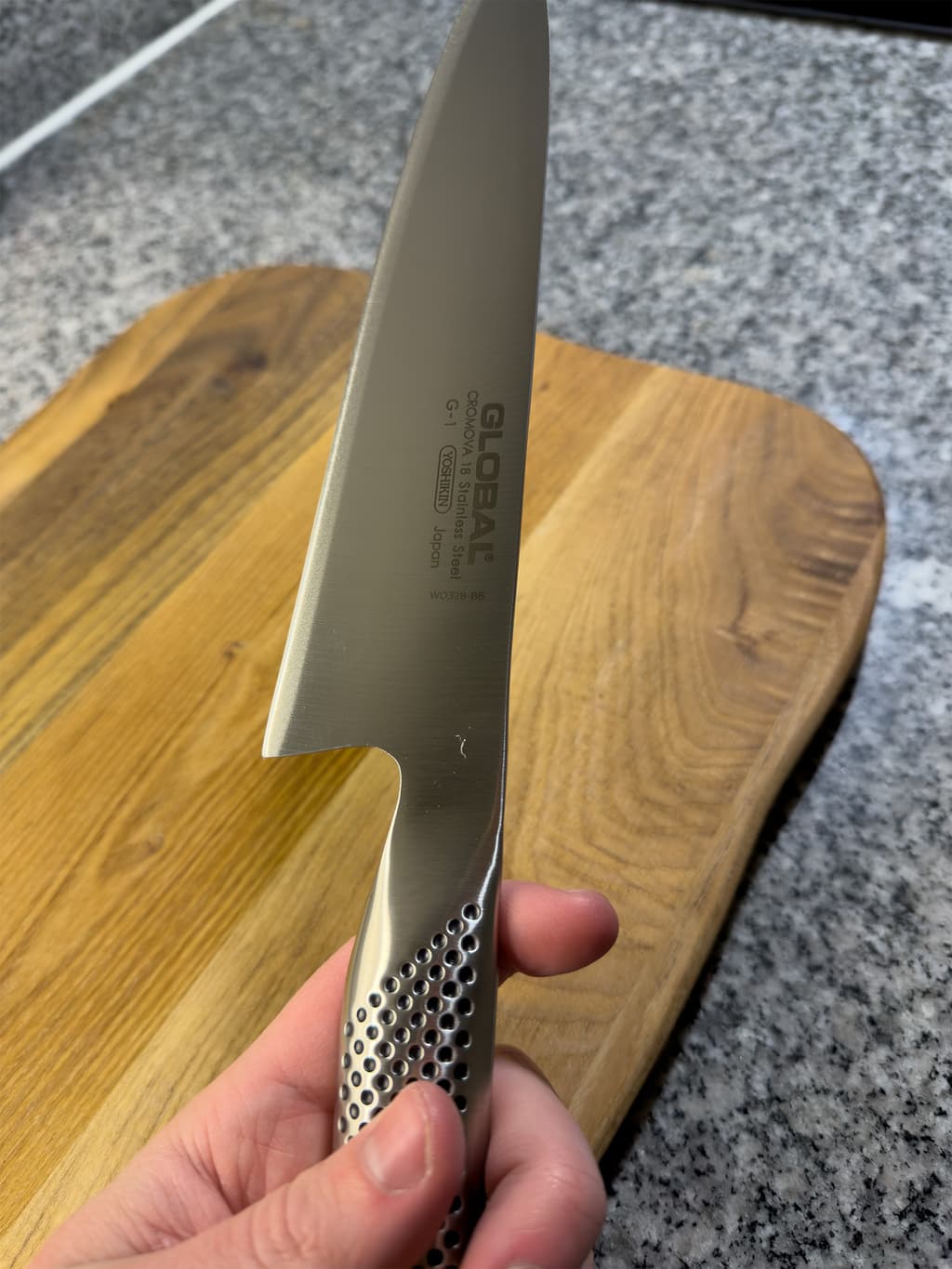 Global kockkniv rundad i handen